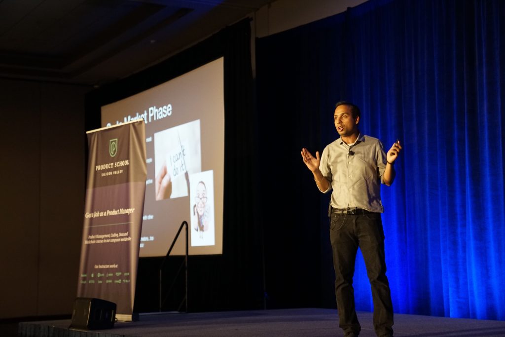 man presenting on a stage