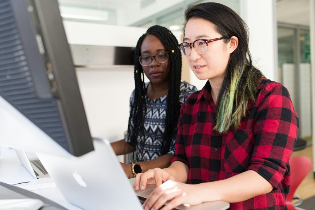 two people sat at a computer